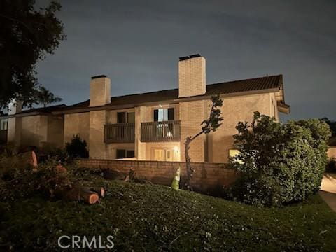 137 Oak Forest Cir, Glendora, CA 91741 - back of house at night with a balcony and a chimney