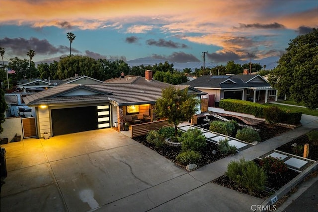 1459 Clock Ave, Redlands, CA 92374 - view of front of home featuring a tiled roof, driveway, and a garage