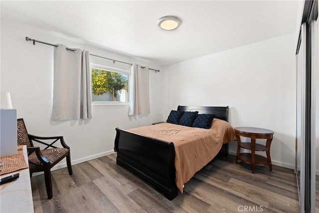 1459 Clock Ave, Redlands, CA 92374 - bedroom with wood finished floors and baseboards