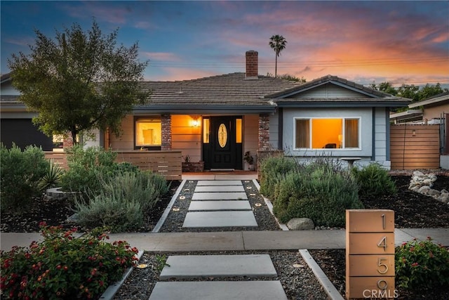 1459 Clock Ave, Redlands, CA 92374 - single story home featuring a porch, a chimney, and a tile roof