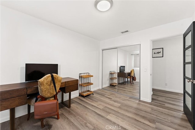 1459 Clock Ave, Redlands, CA 92374 - home office with wood finished floors and baseboards