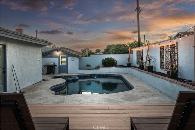1459 Clock Ave, Redlands, CA 92374 - pool at dusk with a fenced backyard and a pool with connected hot tub