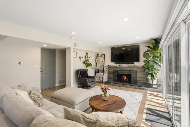 6153 Baltimore Dr, La Mesa, CA 91942 - living room featuring light wood-type flooring, a stone fireplace, recessed lighting, and baseboards