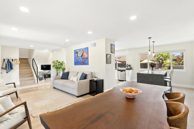 6153 Baltimore Dr, La Mesa, CA 91942 - dining area featuring light wood-style flooring, stairs, recessed lighting, and baseboards