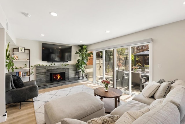 6153 Baltimore Dr, La Mesa, CA 91942 - living room featuring wood finished floors, a premium fireplace, and recessed lighting