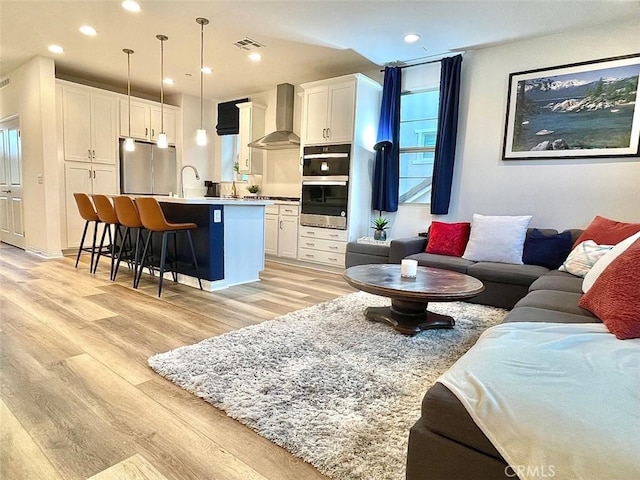 181 Moonflower Rd, Rancho Mission Viejo, CA 92694 - living area with light wood finished floors, recessed lighting, and plenty of natural light