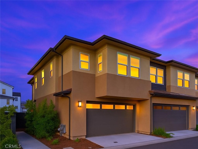 181 Moonflower Rd, Rancho Mission Viejo, CA 92694 - view of front of property featuring an attached garage, stucco siding, and concrete driveway