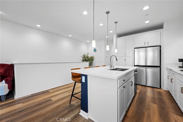 181 Moonflower Rd, Rancho Mission Viejo, CA 92694 - kitchen featuring stainless steel appliances, a sink, recessed lighting, light countertops, and a center island with sink