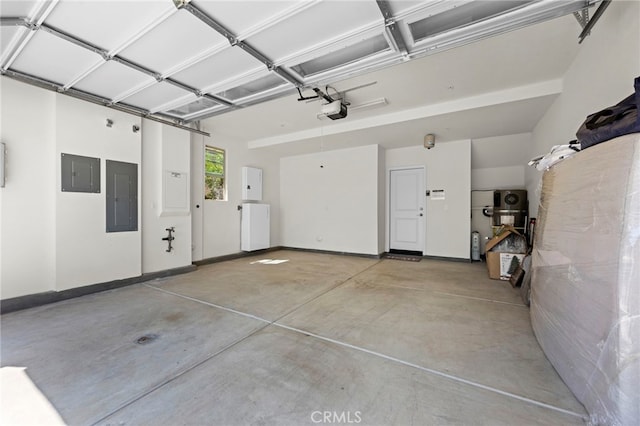 181 Moonflower Rd, Rancho Mission Viejo, CA 92694 - garage featuring electric panel, a garage door opener, and baseboards