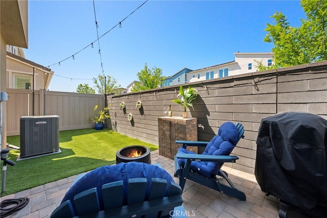 181 Moonflower Rd, Rancho Mission Viejo, CA 92694 - view of patio featuring central AC unit, area for grilling, and an outdoor fire pit
