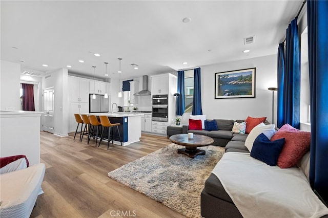 181 Moonflower Rd, Rancho Mission Viejo, CA 92694 - living room with light wood finished floors and recessed lighting