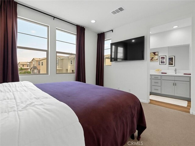 181 Moonflower Rd, Rancho Mission Viejo, CA 92694 - bedroom featuring light colored carpet, a sink, connected bathroom, and recessed lighting