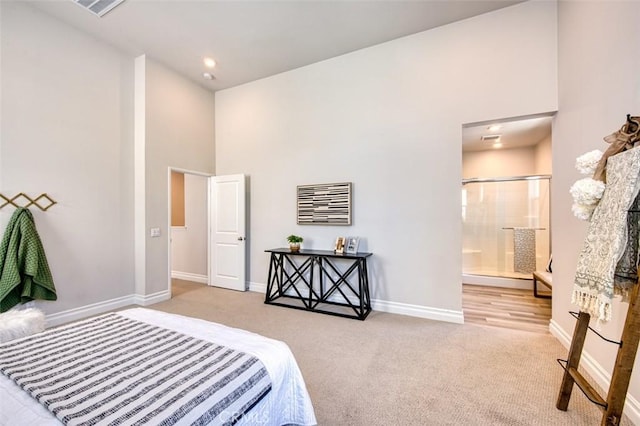 1151 Brush Crk, Rancho Mission Viejo, CA 92694 - bedroom featuring a high ceiling, carpet flooring, baseboards, and connected bathroom