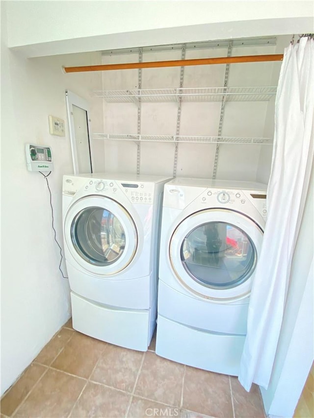 619 Center St, El Segundo, CA 90245 - laundry area featuring washer and dryer and light tile patterned floors