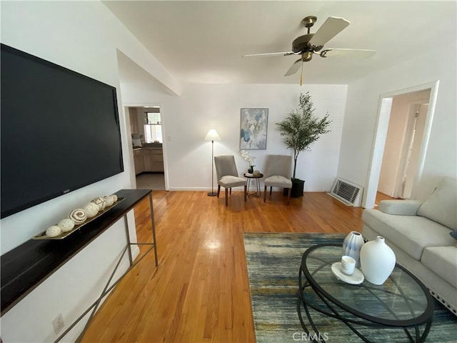 619 Center St, El Segundo, CA 90245 - living room with light wood-type flooring and a ceiling fan