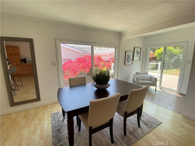 619 Center St, El Segundo, CA 90245 - dining area with ornamental molding, healthy amount of natural light, and light wood-type flooring