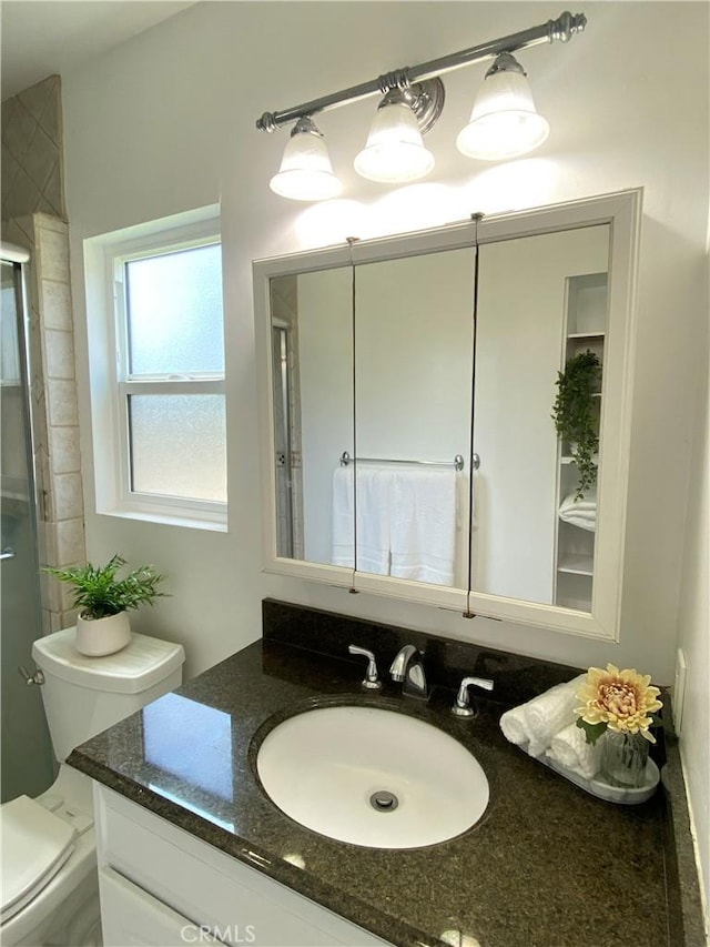 619 Center St, El Segundo, CA 90245 - bathroom featuring vanity, toilet, and an enclosed shower