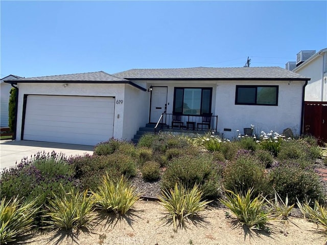 619 Center St, El Segundo, CA 90245 - single story home with stucco siding, a garage, a porch, and concrete driveway