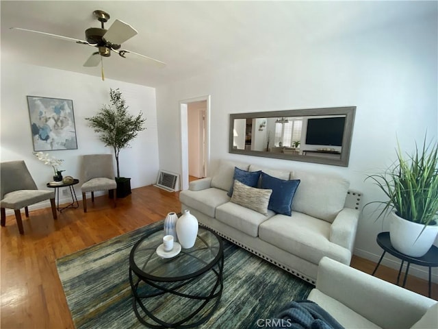619 Center St, El Segundo, CA 90245 - living area with wood finished floors, a ceiling fan, and baseboards