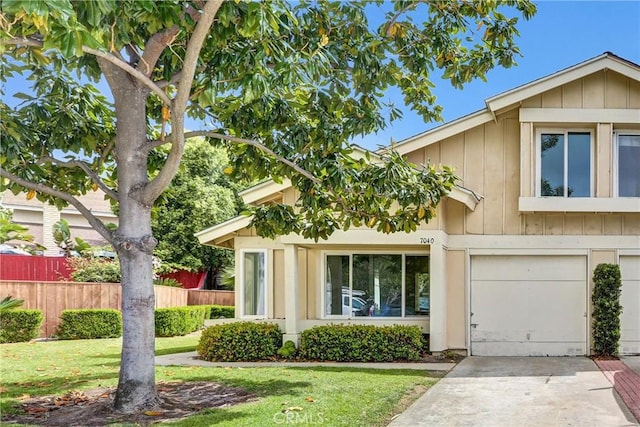 7040 Tenbury Ct, San Diego, CA 92139 - view of front of property with concrete driveway, an attached garage, and board and batten siding