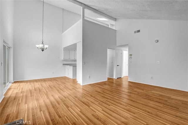 7040 Tenbury Ct, San Diego, CA 92139 - unfurnished living room featuring a chandelier, high vaulted ceiling, and light wood finished floors