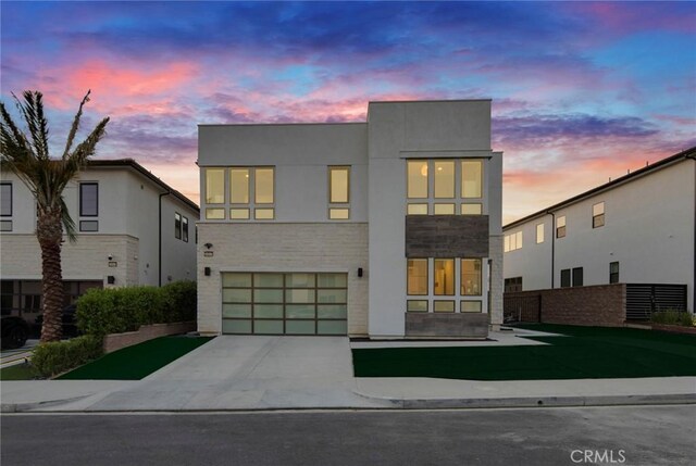 20537 W Overlook Ct, Porter Ranch, CA 91326 - contemporary house featuring a garage, concrete driveway, and stucco siding