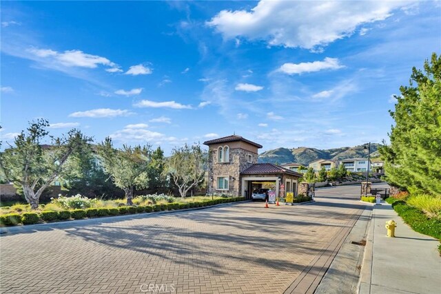 20537 W Overlook Ct, Porter Ranch, CA 91326 - view of decorative road with curbs and a gated entry
