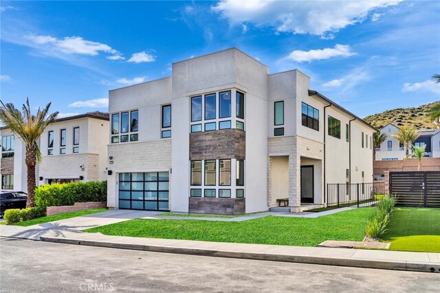 20537 W Overlook Ct, Porter Ranch, CA 91326 - view of building exterior with an attached garage and driveway