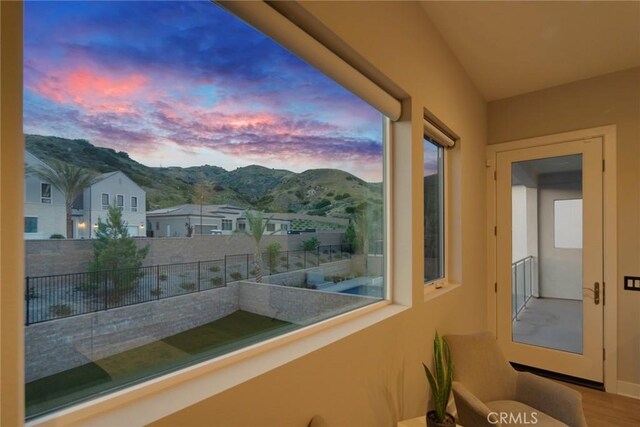 20537 W Overlook Ct, Porter Ranch, CA 91326 - balcony at dusk featuring a mountain view