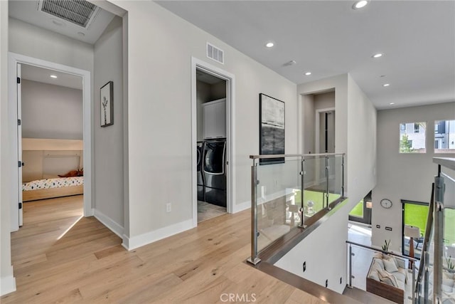 20537 W Overlook Ct, Porter Ranch, CA 91326 - corridor with an upstairs landing, wood finished floors, washer / clothes dryer, and recessed lighting