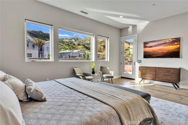 20537 W Overlook Ct, Porter Ranch, CA 91326 - bedroom with wood finished floors, access to exterior, and baseboards