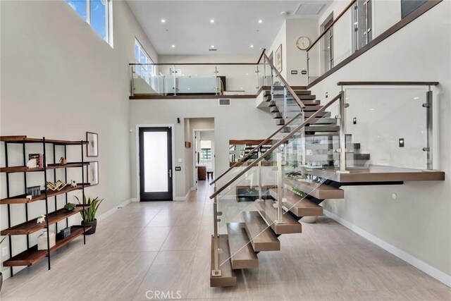 20537 W Overlook Ct, Porter Ranch, CA 91326 - tiled foyer entrance with healthy amount of natural light, stairs, a towering ceiling, baseboards, and recessed lighting