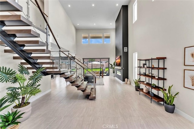 20537 W Overlook Ct, Porter Ranch, CA 91326 - stairway featuring a towering ceiling, baseboards, and recessed lighting