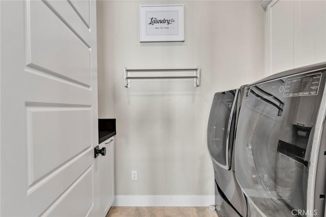 20537 W Overlook Ct, Porter Ranch, CA 91326 - laundry area featuring washer and dryer and cabinet space