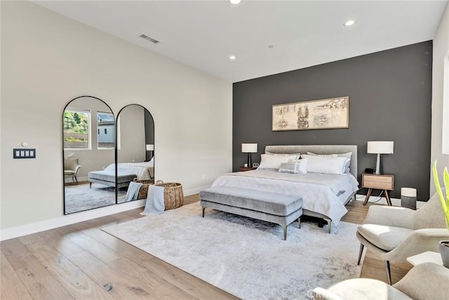 20537 W Overlook Ct, Porter Ranch, CA 91326 - bedroom featuring wood finished floors, recessed lighting, and an accent wall