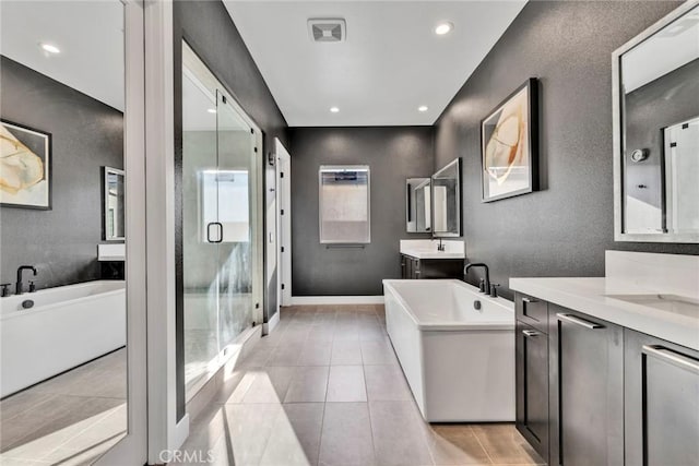 20537 W Overlook Ct, Porter Ranch, CA 91326 - bathroom with two vanities, a shower stall, a soaking tub, tile patterned flooring, and recessed lighting