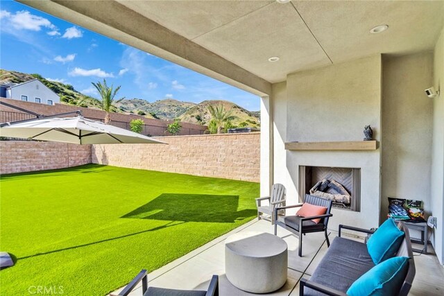 20537 W Overlook Ct, Porter Ranch, CA 91326 - view of patio featuring an outdoor living space with a fireplace and a mountain view