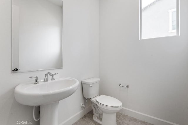 17744 Mcdowell Valley Dr, Riverside, CA 92503 - bathroom with baseboards, toilet, tile patterned floors, and a sink