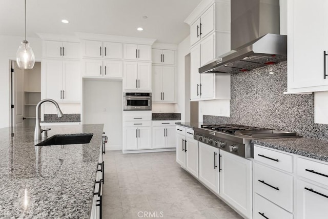 17744 Mcdowell Valley Dr, Riverside, CA 92503 - kitchen featuring a sink, wall chimney range hood, appliances with stainless steel finishes, recessed lighting, and backsplash