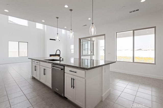 17744 Mcdowell Valley Dr, Riverside, CA 92503 - kitchen featuring a sink, dishwasher, light tile patterned floors, baseboards, and healthy amount of natural light