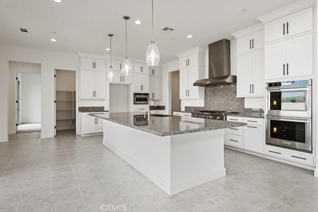 17744 Mcdowell Valley Dr, Riverside, CA 92503 - kitchen with appliances with stainless steel finishes, wall chimney exhaust hood, a sink, tasteful backsplash, and recessed lighting