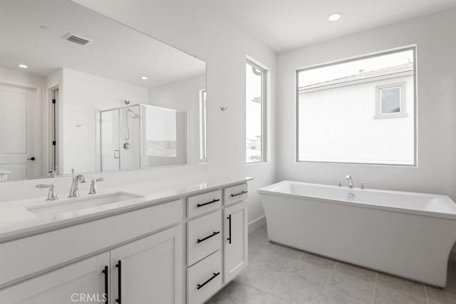 17744 Mcdowell Valley Dr, Riverside, CA 92503 - full bath featuring vanity, a stall shower, a freestanding bath, baseboards, and recessed lighting