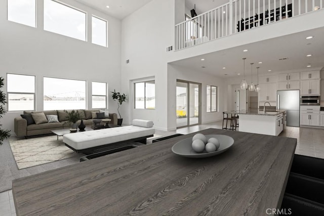 17744 Mcdowell Valley Dr, Riverside, CA 92503 - living room with a towering ceiling, healthy amount of natural light, recessed lighting, and light tile patterned floors