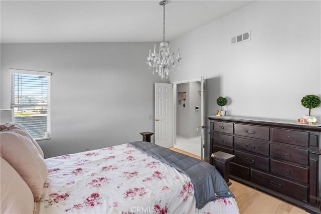 1337 Lloyd Pl, Lompoc, CA 93436 - bedroom featuring a chandelier, light wood-style floors, and lofted ceiling
