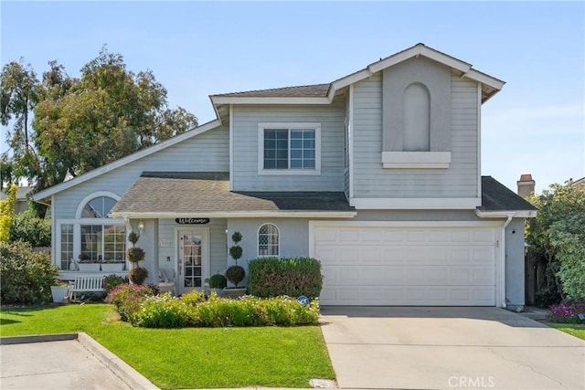 1337 Lloyd Pl, Lompoc, CA 93436 - traditional-style home with an attached garage, concrete driveway, a front lawn, and a shingled roof