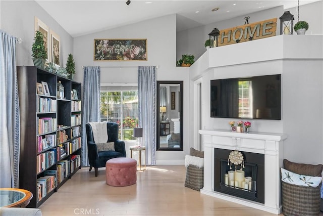 1337 Lloyd Pl, Lompoc, CA 93436 - living area featuring wood finished floors, vaulted ceiling, and baseboards