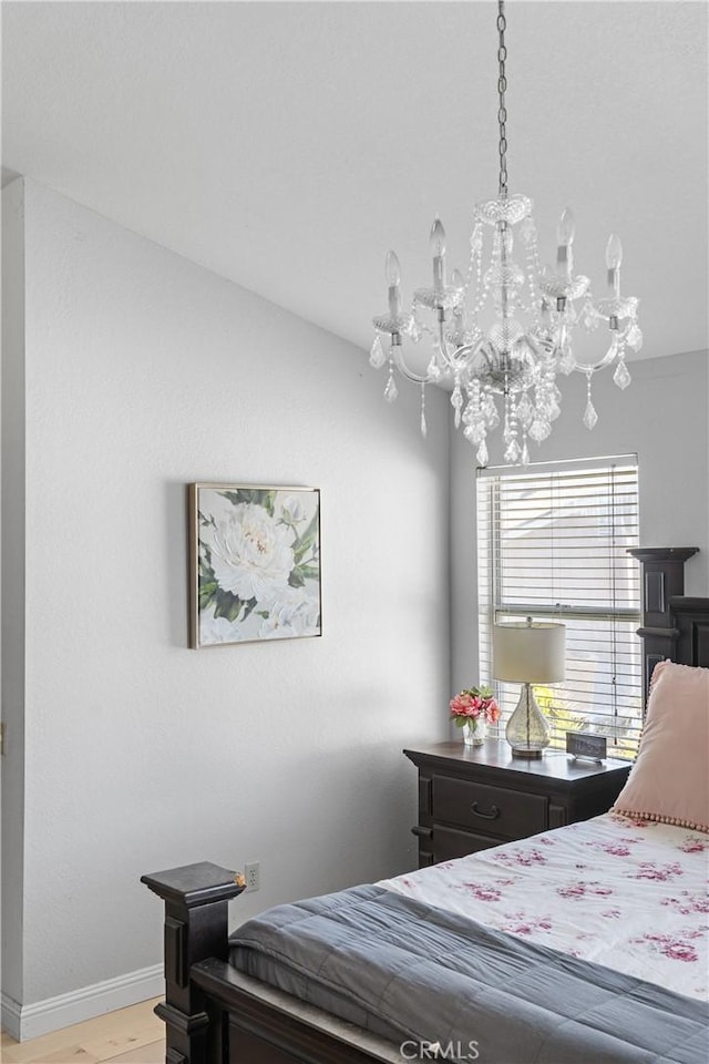 1337 Lloyd Pl, Lompoc, CA 93436 - bedroom with a chandelier, light wood-style flooring, and baseboards