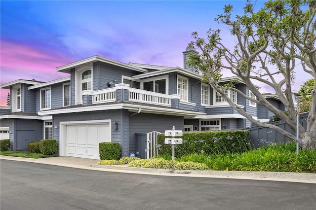 3510 Lilac Ave Unit 13, Corona Del Mar, CA 92625 - view of front facade featuring a balcony, a chimney, and an attached garage