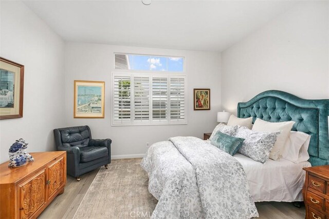 3510 Lilac Ave Unit 13, Corona Del Mar, CA 92625 - bedroom with light wood-style floors and baseboards