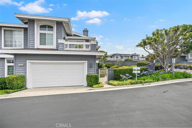 3510 Lilac Ave Unit 13, Corona Del Mar, CA 92625 - multi unit property featuring a chimney, concrete driveway, a garage, and a balcony